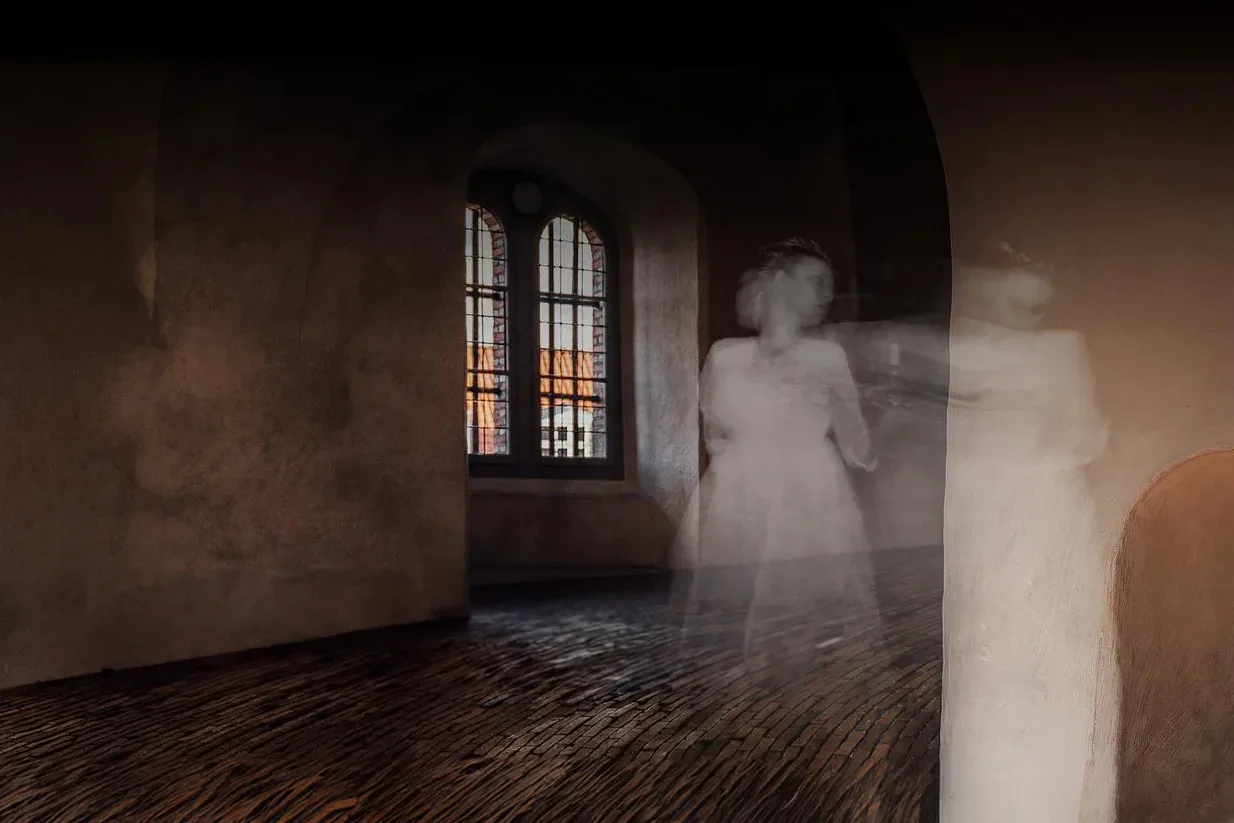 Two ghosts haunting a room during Halloween in Copenhagen.