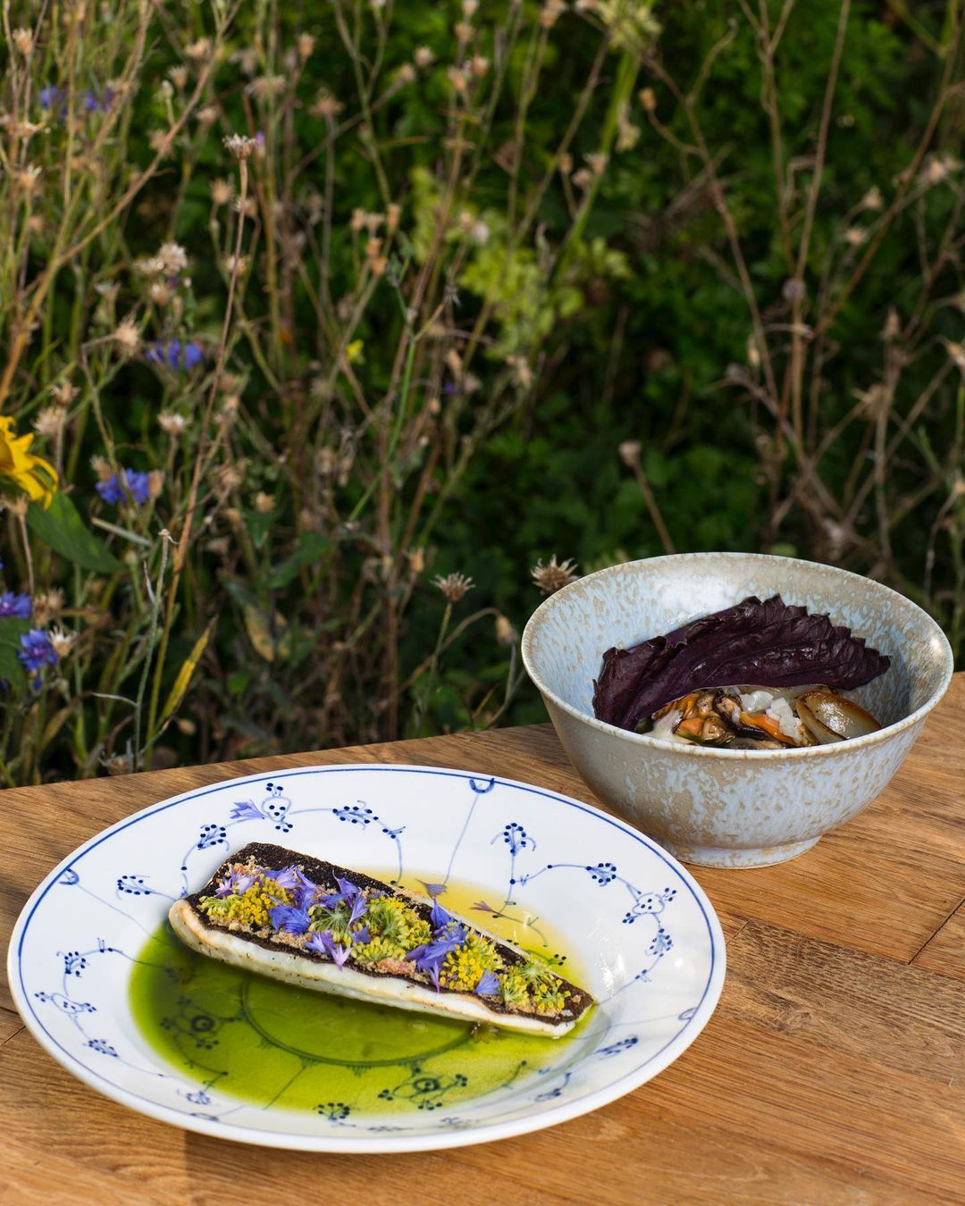 A plate of food on a wooden table.