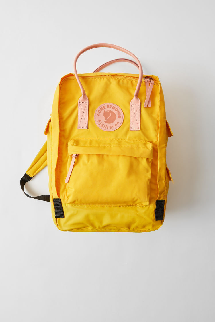 Fjällräven kanken backpack in yellow.