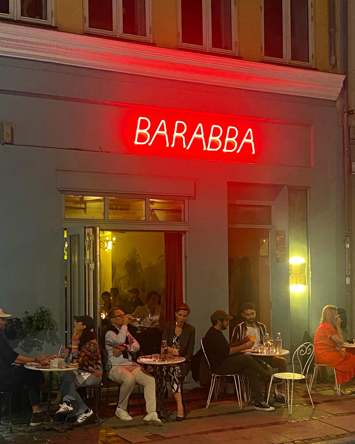 People dining at tables outside of a Copenhagen restaurant.