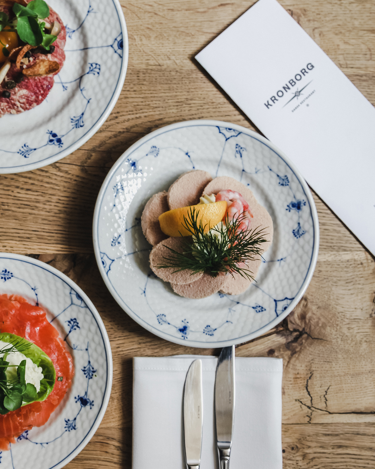 Three plates of food at a Copenhagen restaurant.