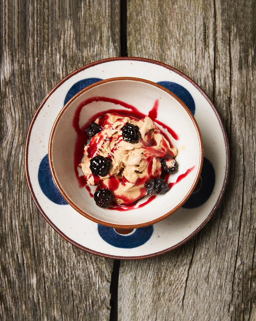 A bowl of ice cream with blackberries in a Copenhagen restaurant.