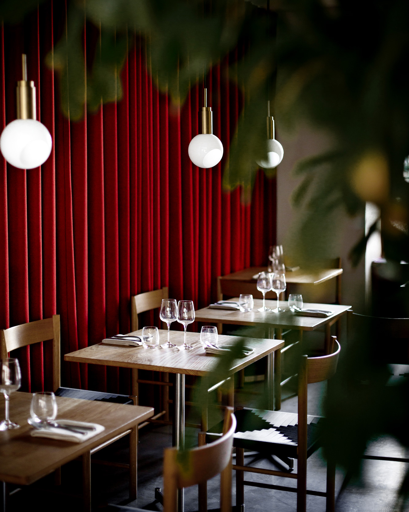 A Copenhagen restaurant with red curtain.