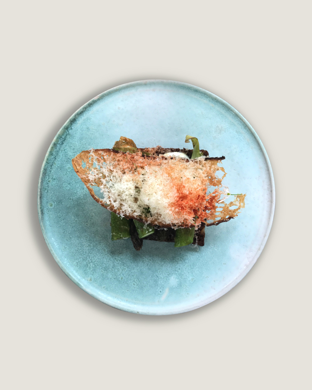 A plate with a piece of food on it at Copenhagen restaurants.